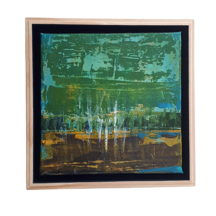 Abstracted landscape painting with green and blue tones framed in a custom light wood float frame