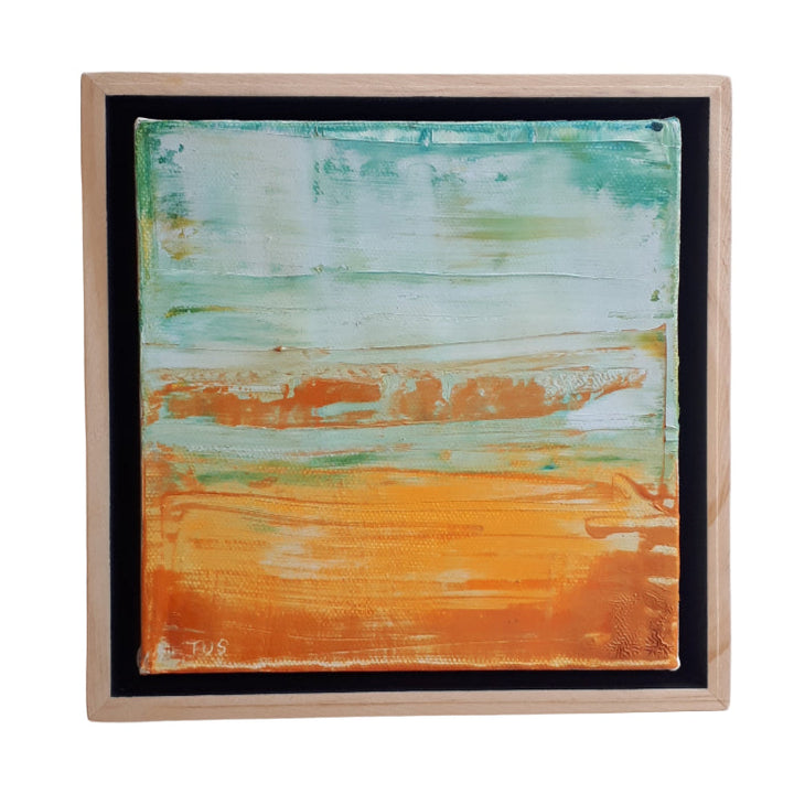 Framed abstracted landscape painting with orange and aqua hues.